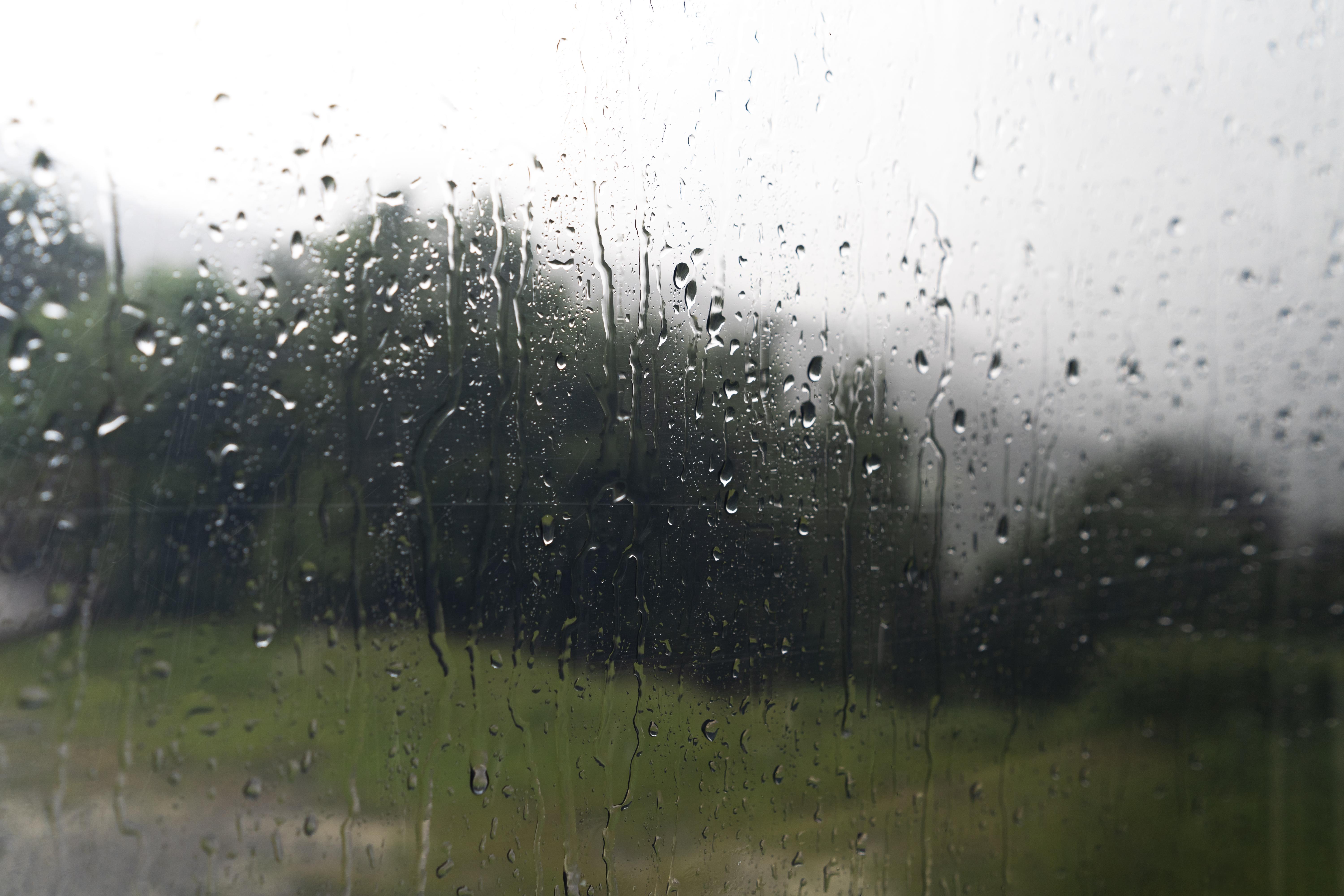 camper window with rain drops